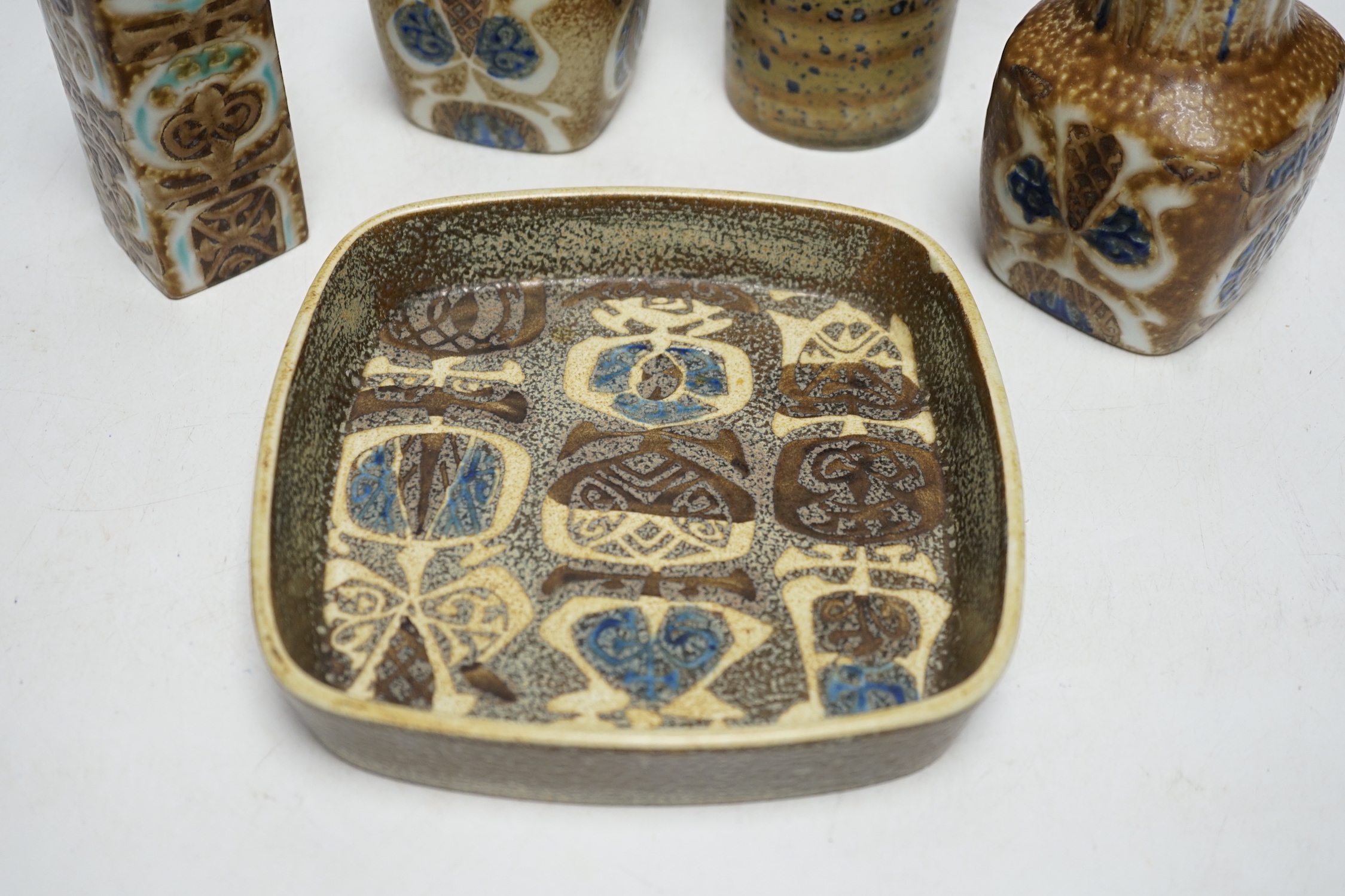 Five Royal Copenhagen fajance or Alumina items by Nils Thorssen, four vases and a square section shallow dish, tallest 19cm